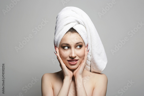young wet woman with towel on her head. Beautiful sexy Girl with wet Hair after Shower