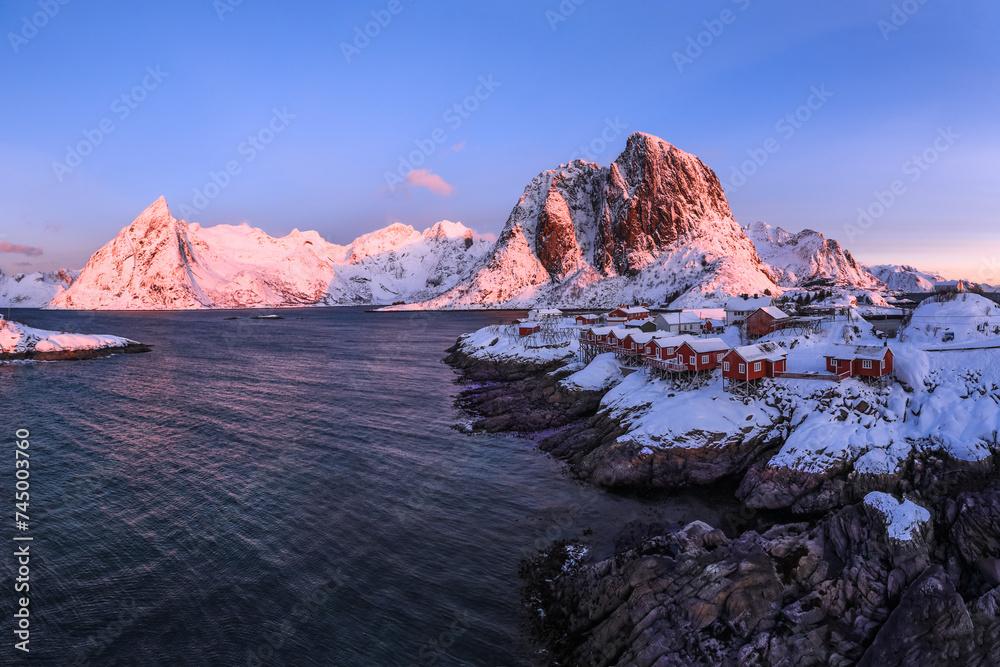 Traditional Norwegian fisherman's cabins, rorbuer, on the island of Hamnoy, Reine on the Lofoten at sunrise time Norway.