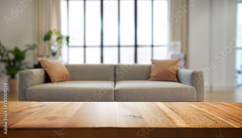 Wooden empty table in front of Living room sofa interior. For product display and presentation