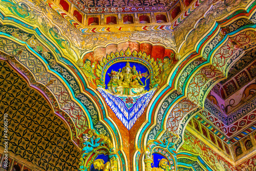 Thanjavur, Tamil Nadu, India - The high arches artworks and colorfully painted wall murals and ceilings of the ancient 17th-century durbar hall Maratha Palace in the town of Thanjavur. photo