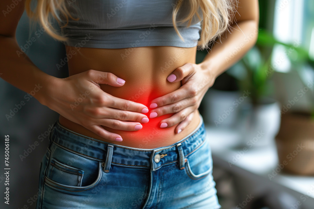 Menstrual pain, woman with stomachache suffering from pms at home, endometriosis, cystitis and other diseases of the urinary system, painful area highlighted in red - obrazy, fototapety, plakaty 