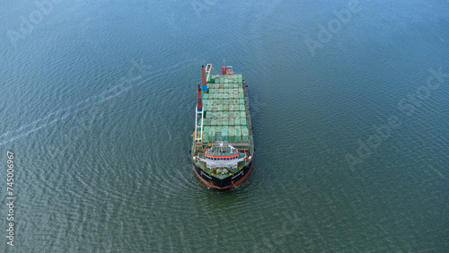 Aerial view of a large ship carrying containers in the Kalimantan sea, shipping containers, inter island trade