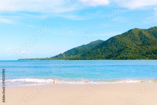 Beautiful beach in Thailand and Majestic Mountains island in the background.