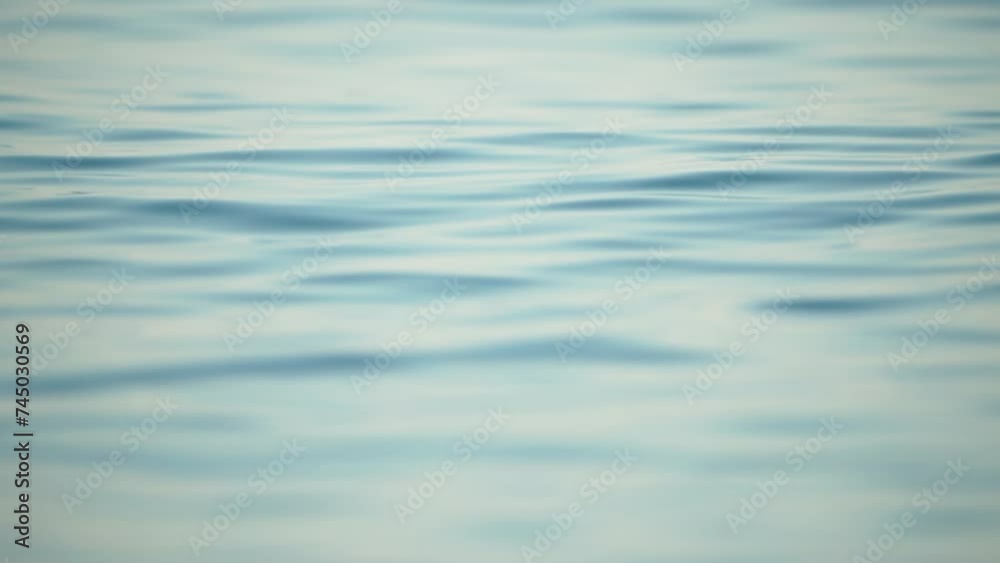 Sea water surface. Camera flies over the calm azure sea. Nobody. Holiday recreation concept. Abstract nautical summer ocean nature. Weather and climate change. Slow motion. Close up Sea water surface. Camera flies over the calm azure sea. Nobody. Holiday recreation concept. Abstract nautical summer ocean nature. Weather and climate change. Slow motion. Close up