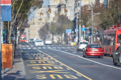 Bus lane sign on the road.