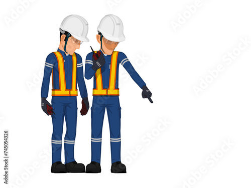 Two workers are considering something on the floor