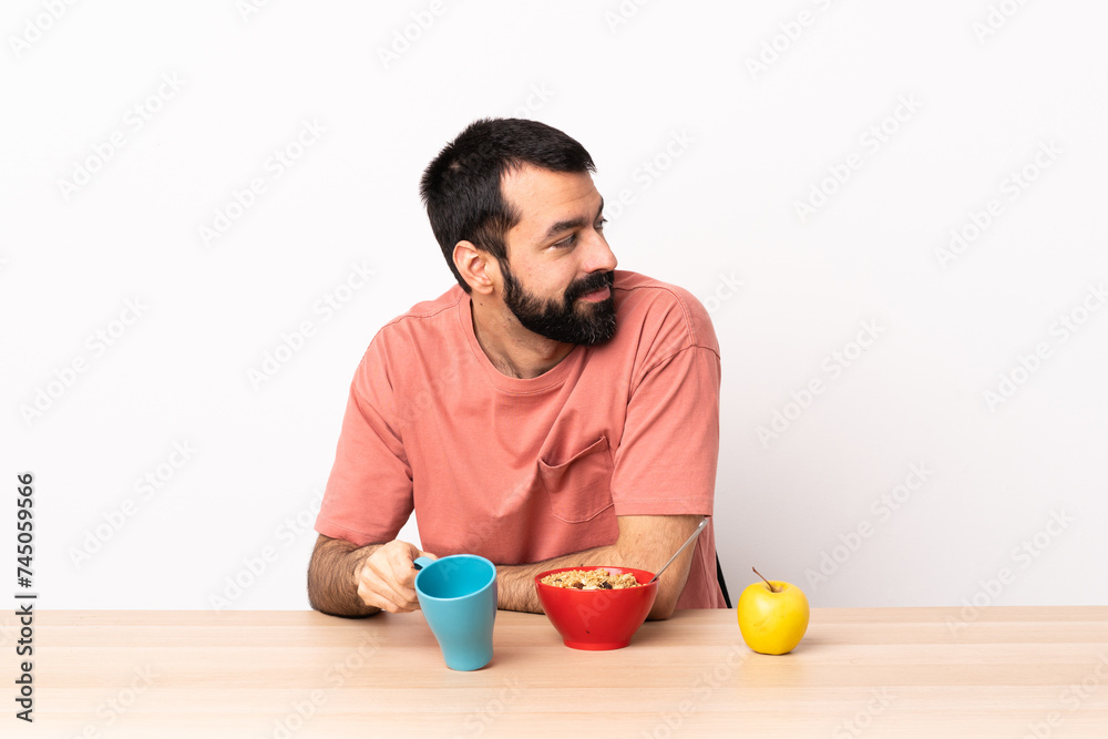 Caucasian man having breakfast in a table . Portrait. Caucasian man having breakfast in a table . Portrait.