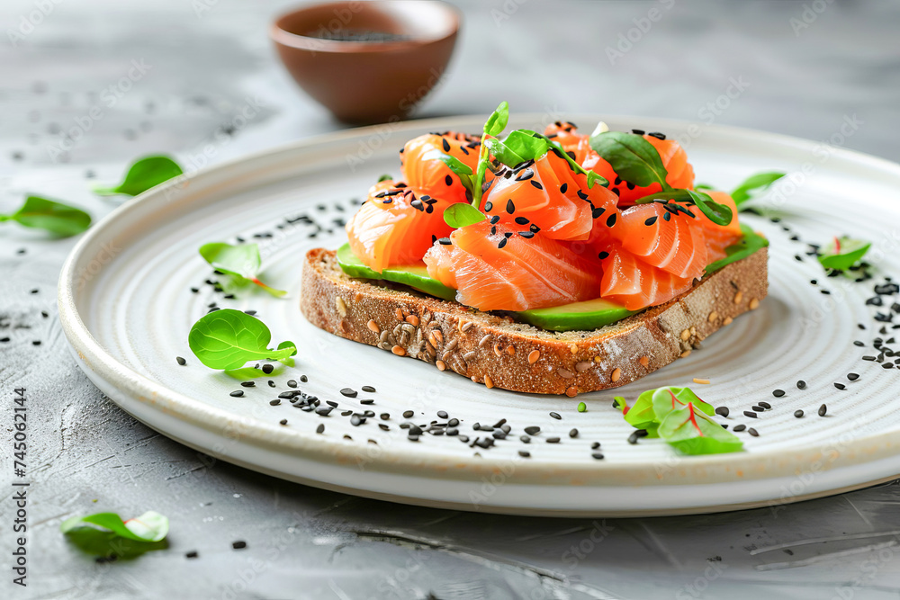 Toast with avocado and salmon with sesame seeds, chard leaves. Toast with avocado and salmon with sesame seeds, chard leaves.