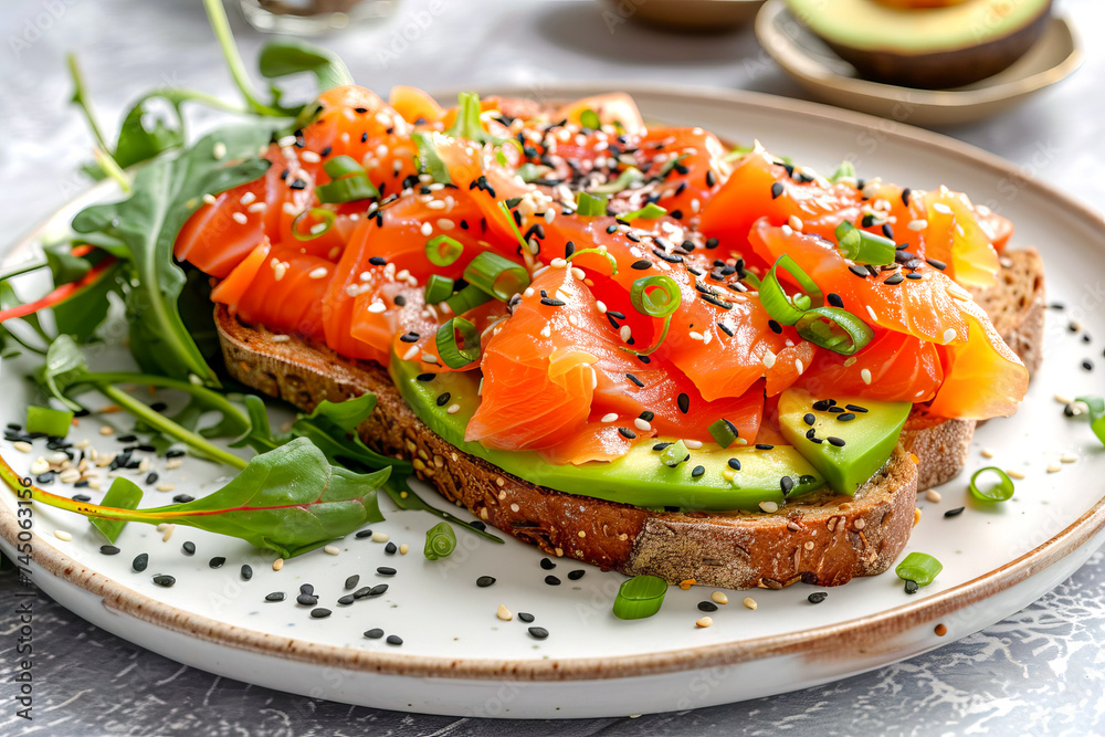 Toast with avocado and salmon with sesame seeds, chard leaves. Toast with avocado and salmon with sesame seeds, chard leaves.