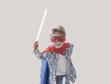 Cute superhero boy holding a laser sword