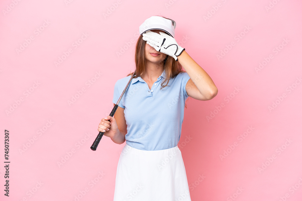Young golfer player man isolated on pink background covering eyes by hands. Do not want to see something