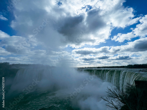 Niagara Falls, Ontario, Canada. Niagara Falls is the largest waterfall in the world. Beautiful view fro the ground near waterfall