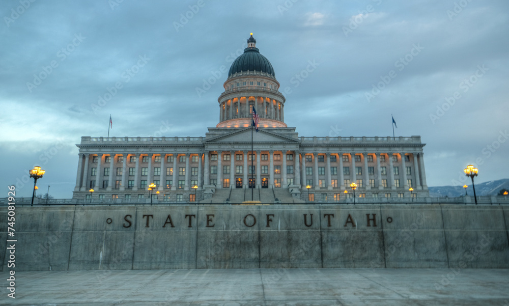 Utah State Capital Building glowing against sky and clouds in Salt Lake City