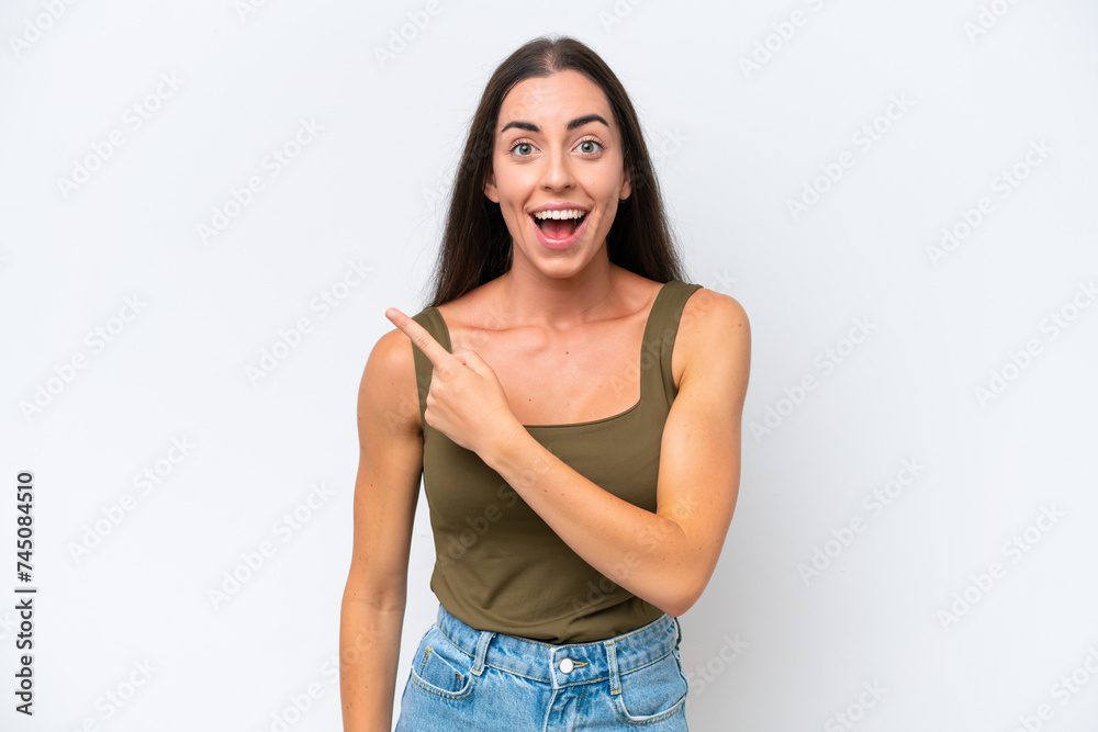 Young caucasian woman isolated on white background surprised and pointing side Young caucasian woman isolated on white background surprised and pointing side
