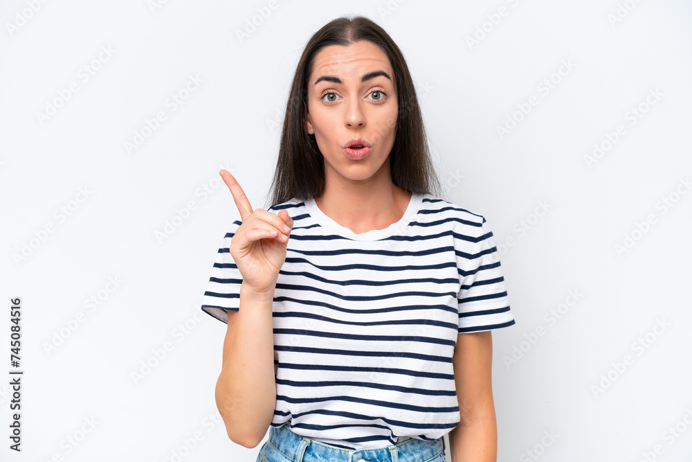 Young caucasian woman isolated on white background intending to realizes the solution while lifting a finger up Young caucasian woman isolated on white background intending to realizes the solution while lifting a finger up