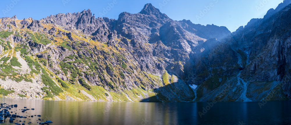 Stunning panoramic view of Czarny Staw pod Rysami Lake and the Rysy mountain massif in Poland's Tatra National Park