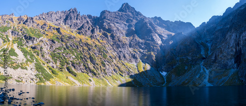 Stunning panoramic view of Czarny Staw pod Rysami Lake and the Rysy mountain massif in Poland's Tatra National Park