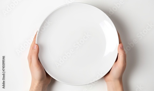 A Person Holding a White Plate With a Delicious Meal