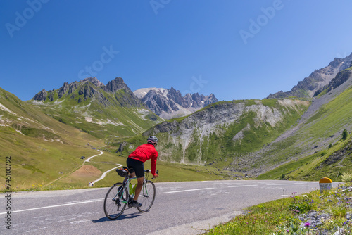 cyclist on route des Grandes Alpes near Col du Galibier, Hautes-Alpes, France