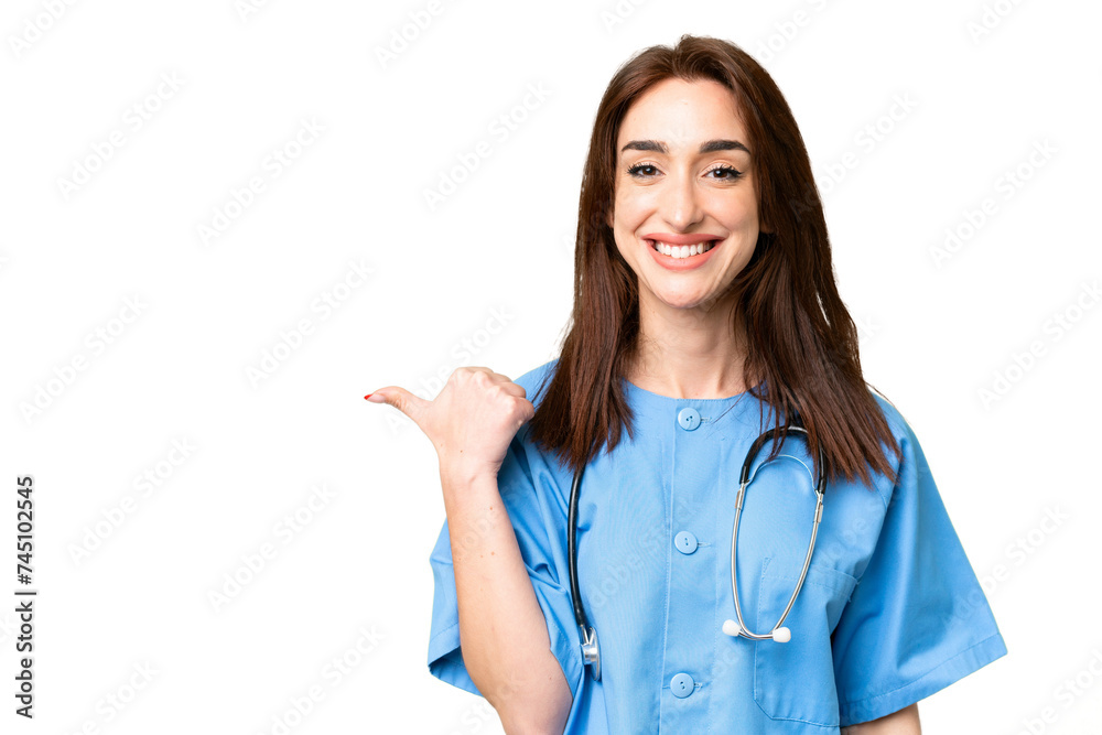 Young nurse woman over isolated chroma key background pointing to the side to present a product Young nurse woman over isolated chroma key background pointing to the side to present a product