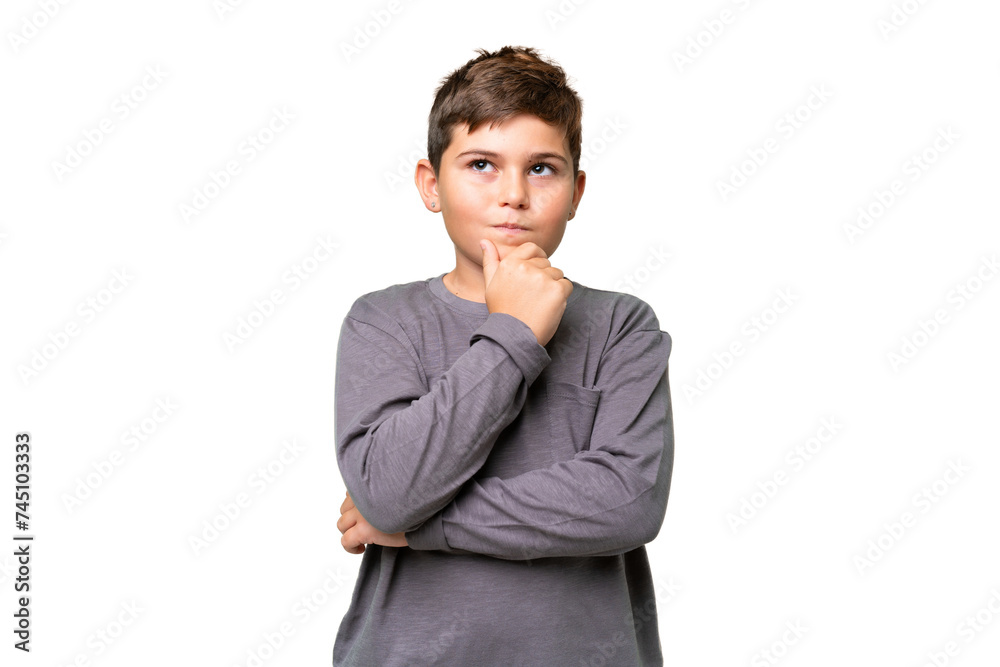 Little caucasian kid over isolated chroma key background thinking an idea while looking up Little caucasian kid over isolated chroma key background thinking an idea while looking up