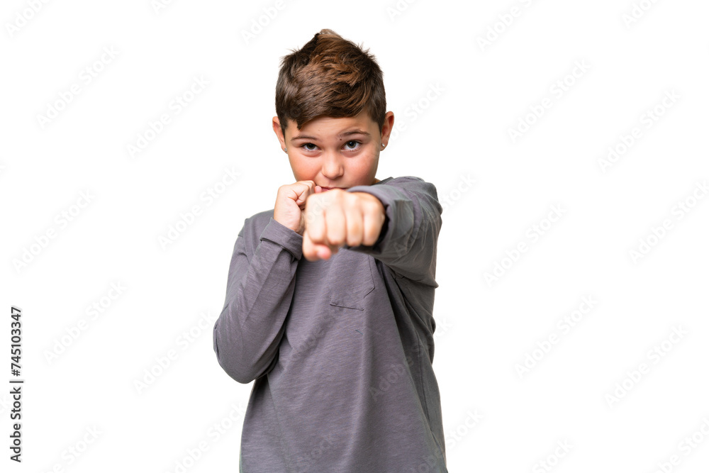 Little caucasian kid over isolated chroma key background with fighting gesture Little caucasian kid over isolated chroma key background with fighting gesture