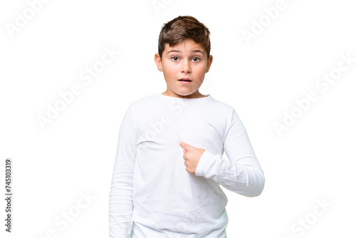 Little caucasian kid over isolated chroma key background pointing to oneself © luismolinero