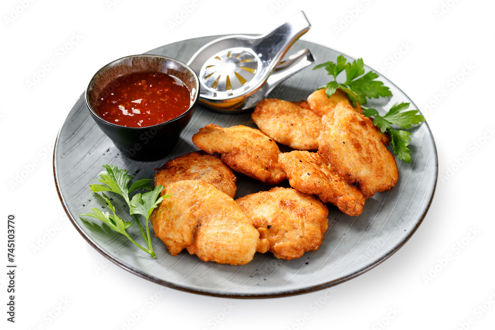 Chicken breast fried in batter or nuggets with chili sauce. isolated on white background Chicken breast fried in batter or nuggets with chili sauce. isolated on white background