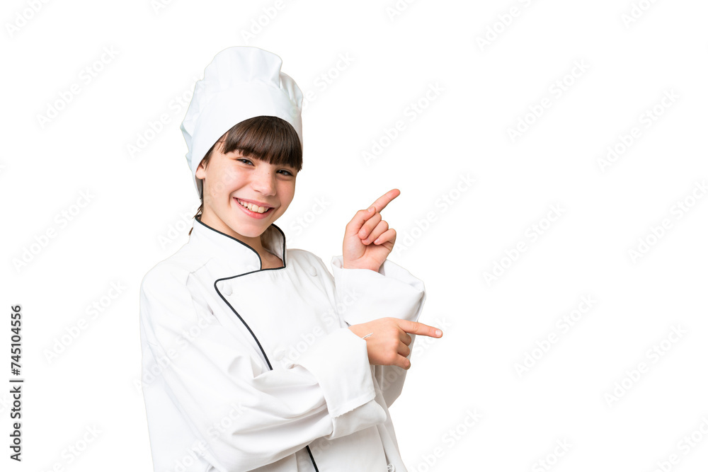 Little caucasian chef girl over isolated background pointing finger to the side and presenting a product Little caucasian chef girl over isolated background pointing finger to the side and presenting a product