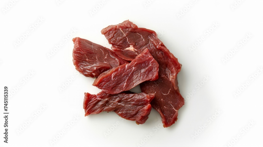Fototapeta premium Piece of raw beef isolated on white background, top view, with clipping path