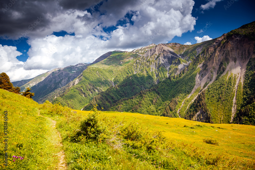 Attractive view of the Main Caucasus Range and green alpine meadows. Upper Svaneti region, Georgia.