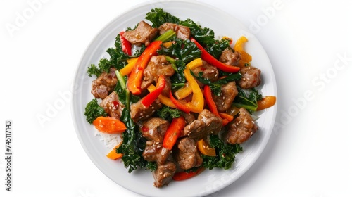 Thai food Stir-fried Crispy Pork spicy and Chinese kale served without rice decorate with green peppers yellow chili and carrots carved white plate top view isolated on white background