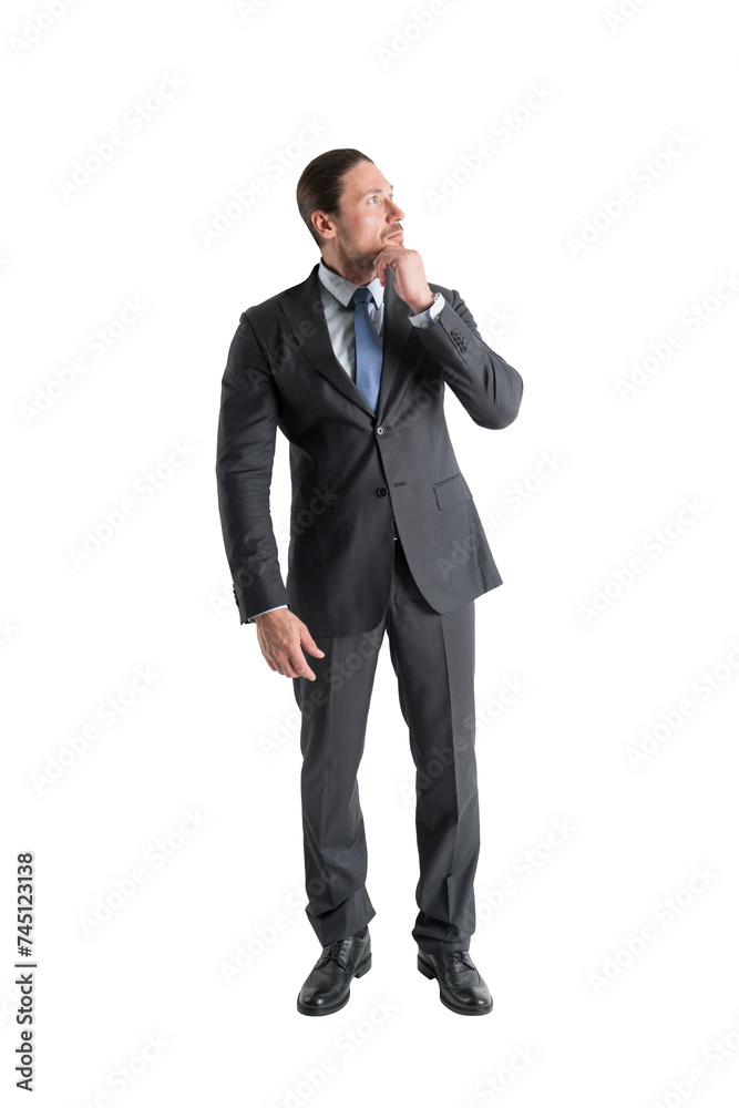 Executive contemplating, standing with hand on chin against white, business strategy concept Executive contemplating, standing with hand on chin against white, business strategy concept