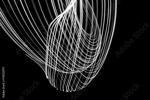 Abstract curved lines on a black background. night photography with lightpainting technique.