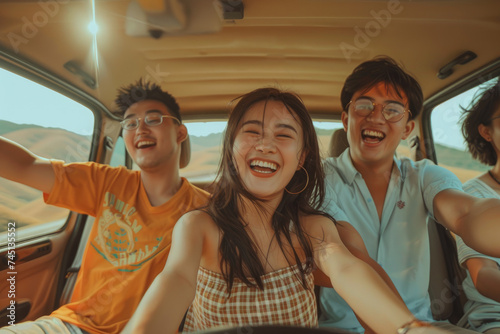 Group of young energetic Asian friends road trip together during summertime