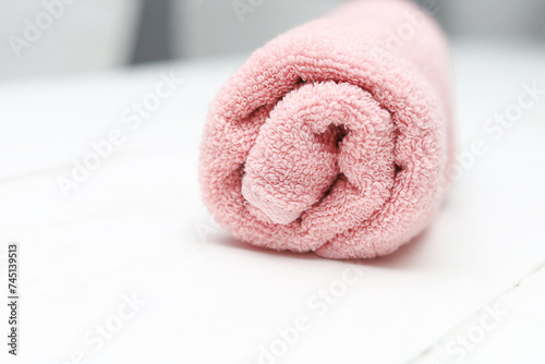 Pink cotton towel on white background.