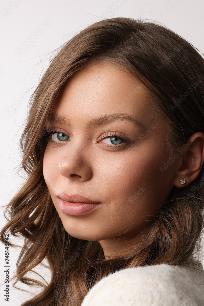 Beautiful young girl with fresh healthy skin. Woman advertise ear-rings. White background. Earrings closeup. Blond european woman with long hair with big lips, pretty smile. Cosmetology, scincare. Beautiful young girl with fresh healthy skin. Woman advertise ear-rings. White background. Earrings closeup. Blond european woman with long hair with big lips, pretty smile. Cosmetology, scincare.