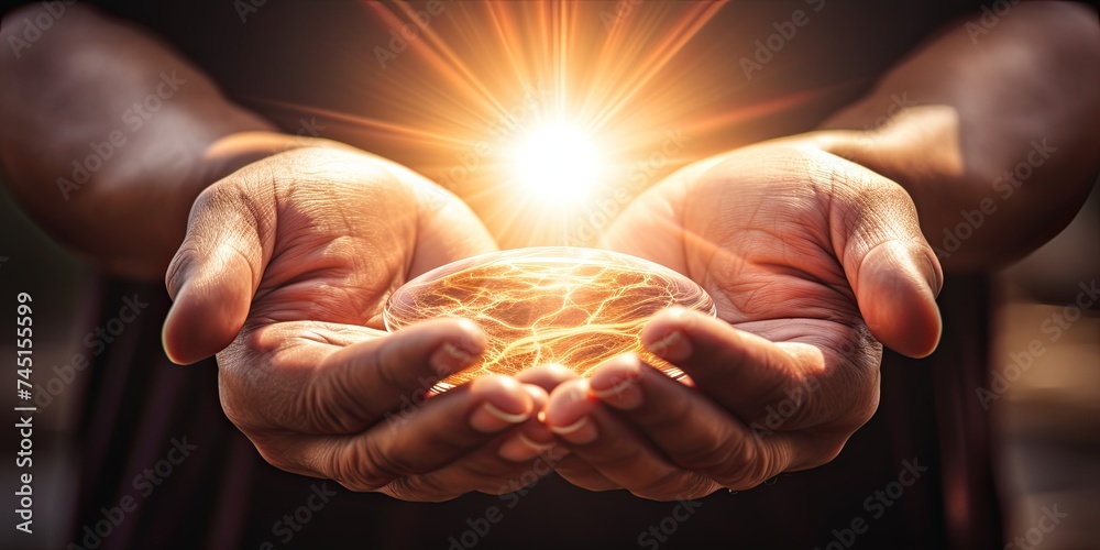 Hands clasped in prayer, illuminated by a radiant light, symbolizing divine presence and spiritual enlightenment - obrazy, fototapety, plakaty 