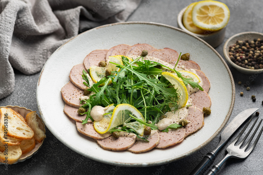 Vitello Tonnato, traditional Italian dish, selective focus Vitello Tonnato, traditional Italian dish, selective focus