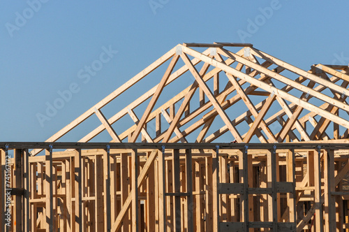 The top of a wooden frame of a new single-home under construction