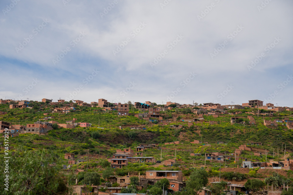 houses built on a hill, hillside settlements, urban development in latin america
