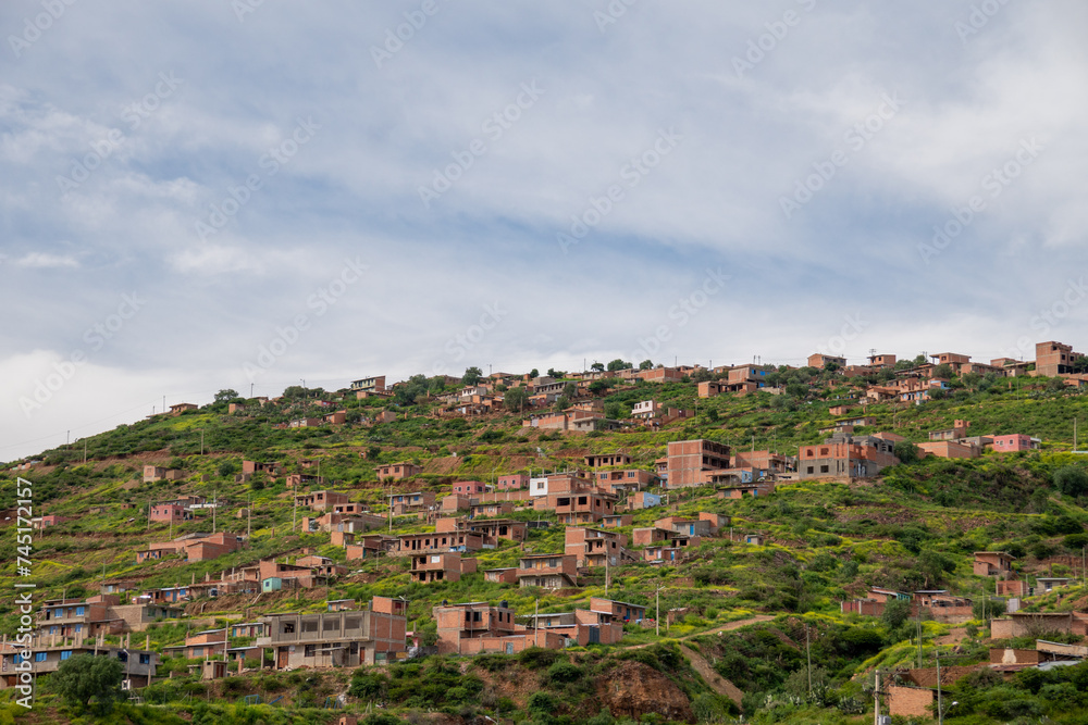 houses built on a hill, hillside settlements, urban development in latin america