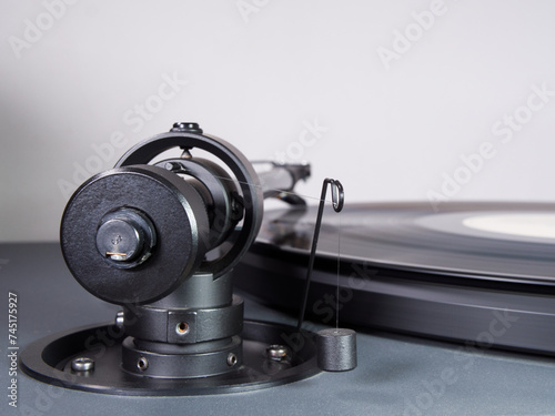 Canvas Print Closeup of the rear of a tonearm with a suspended balancing weight