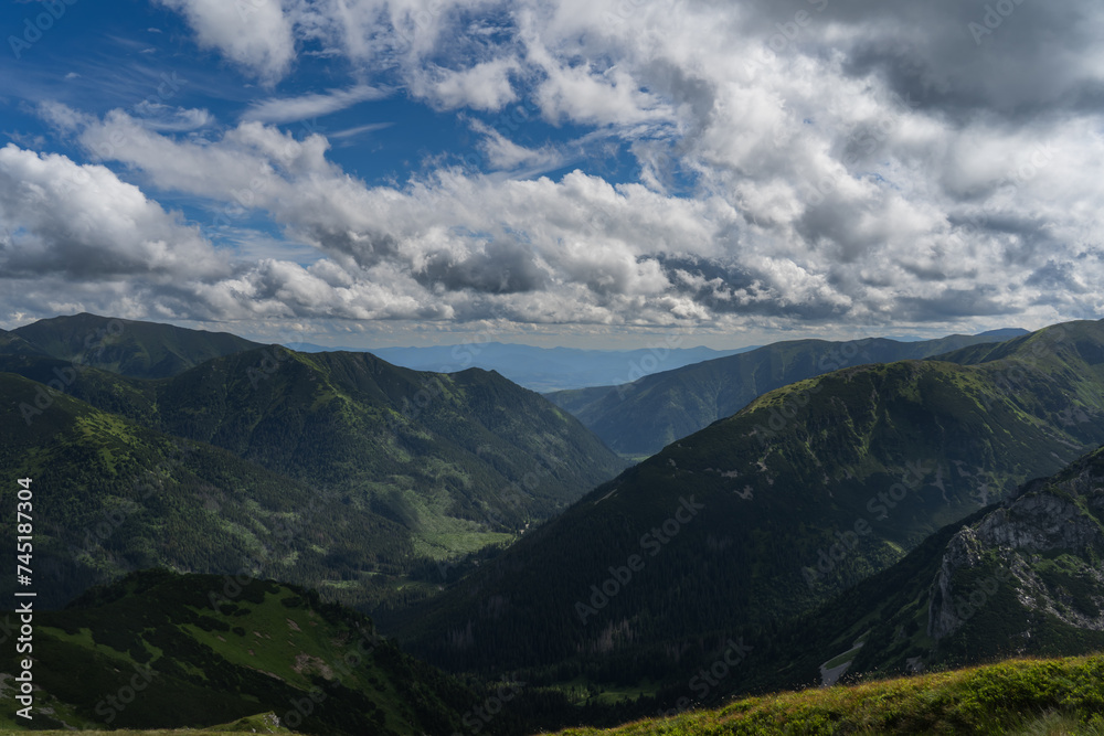 Mountain landscape in the Polish mountains in summer, sky with storm clouds.