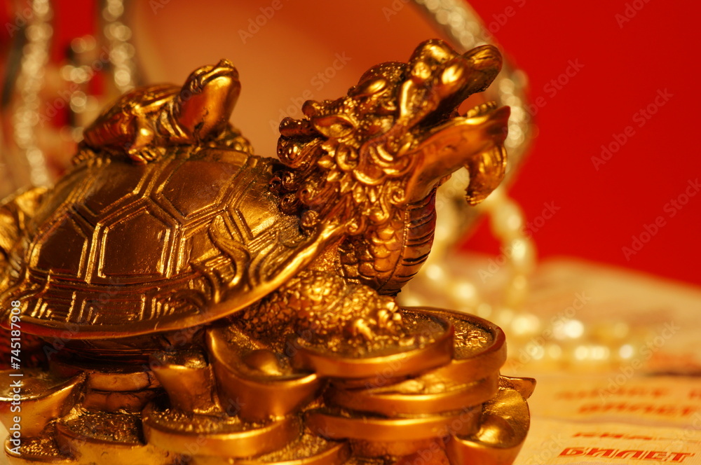 A figurine of a Chinese dragon on the background of jewelry.