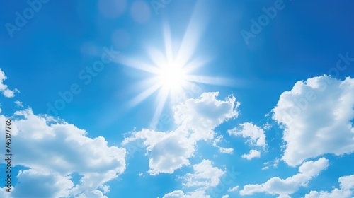 Sun shining through clouds in blue sky, ideal for weather-related designs