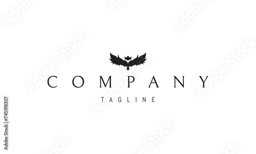 A vector logo with an abstract image of the wings of a bird with a crown instead of a head.