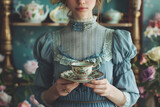 Woman holding vintage teacup in a floral setting. Victorian tea party concept for design and print