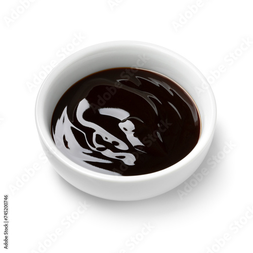 Single white bowl with oyster sauce isolated on white background close up © Picture Partners