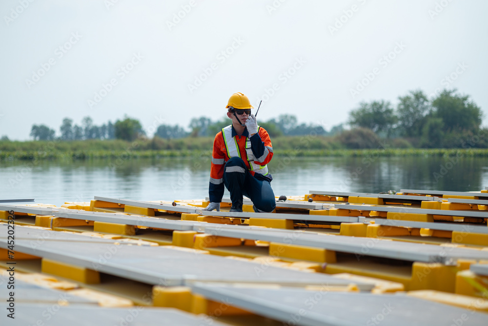 Engineer Inspecting Solar Panels at Power Plant Engineer Inspecting Solar Panels at Power Plant